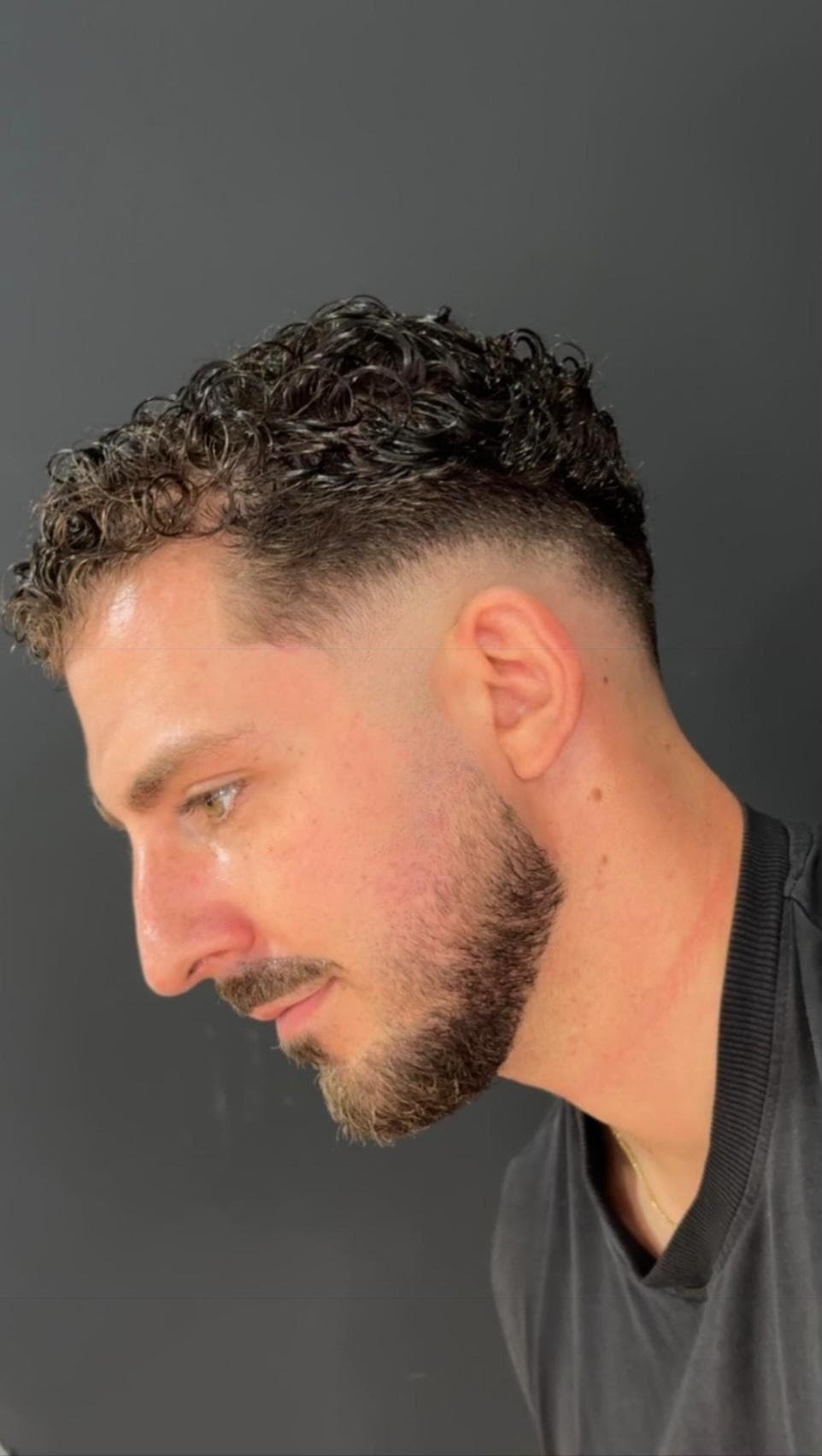 Curls with a fade and beard