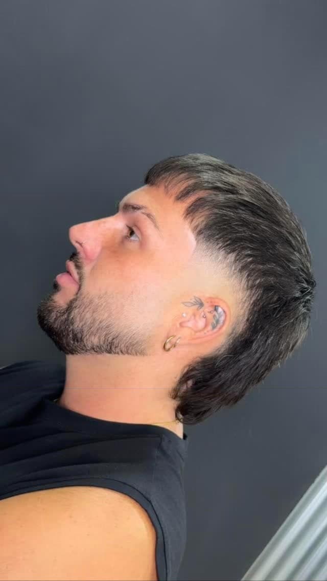 Mullet with a fade and a shaped beard